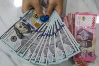 ilustrasi mata uang dolar dan rupiah.