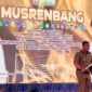 Kepala Bappeda Sultra J Robert saat menyampaikan laporan dalam pembukaan Musrenbang 2025 di Kota Baubau.